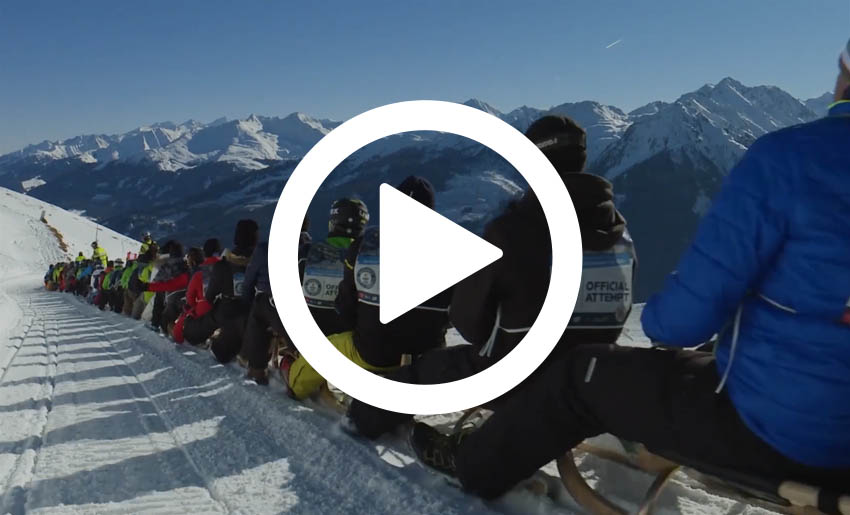 Many people on sleds doing a record attempt