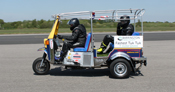 2 people on fastest tuk-tuk