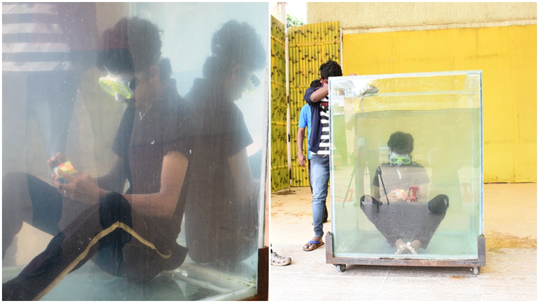 split image of the most Rubik's cubes solved underwater record attempt one of the tank close up on showing the full tank