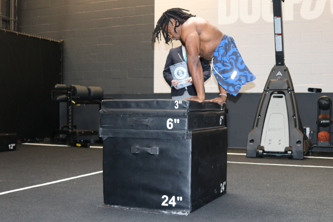 zion-clark-performing-a-box-jump-using-his-hands.jpg