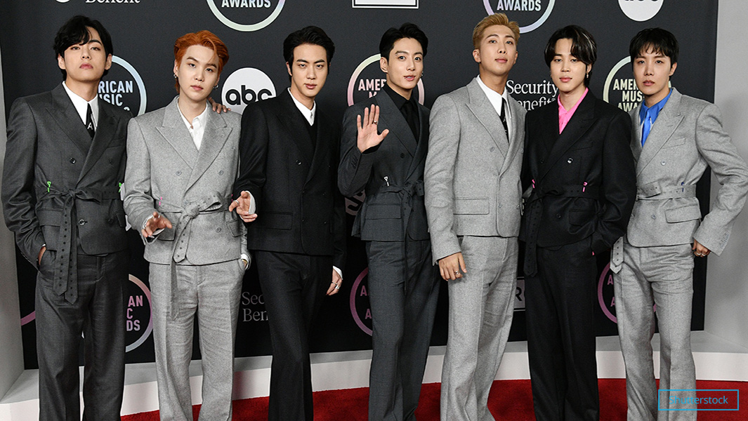 BTS header with grey suits