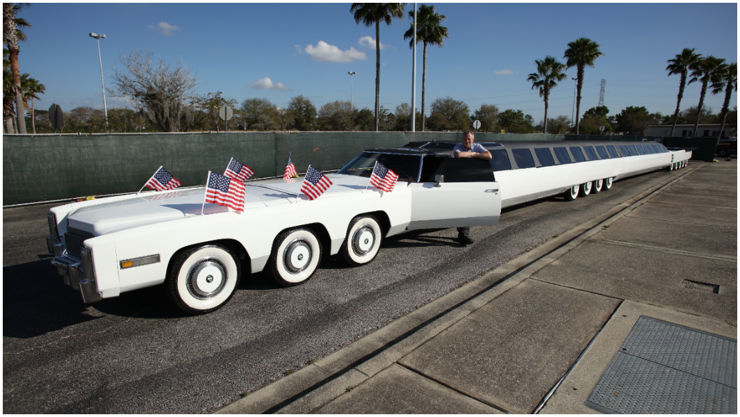 header-image-of-Michael-Manning-standing-at-door-of-restored-worlds-longest-car